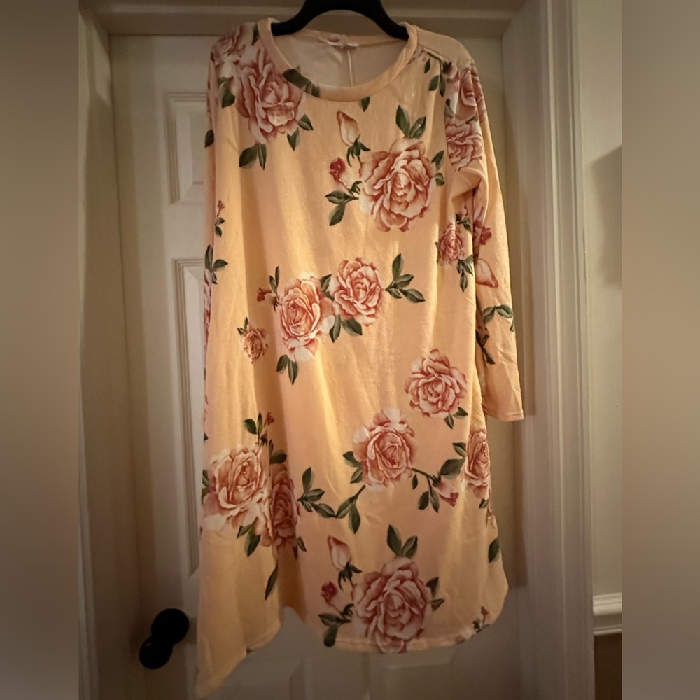 Floral dress. Stretchy material. New without tags. Only tried on